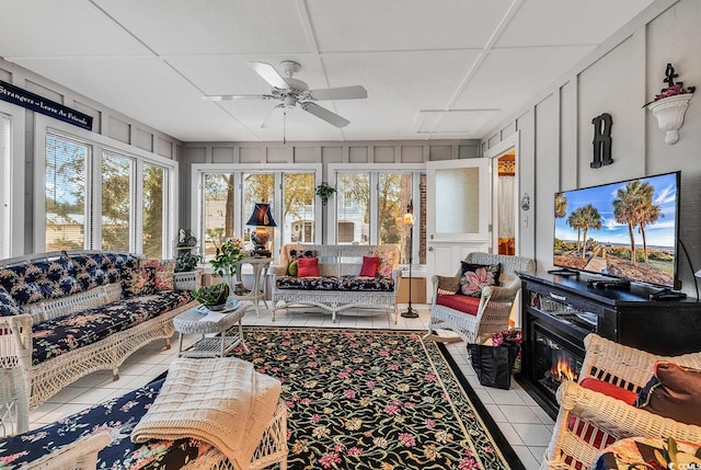 sunroom featuring ceiling fan