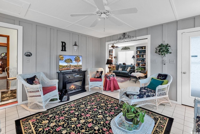 living room with light tile patterned flooring and ceiling fan