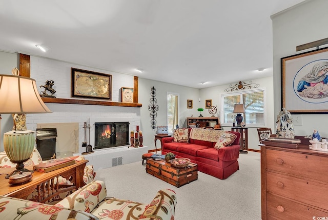 living room with a fireplace and light colored carpet