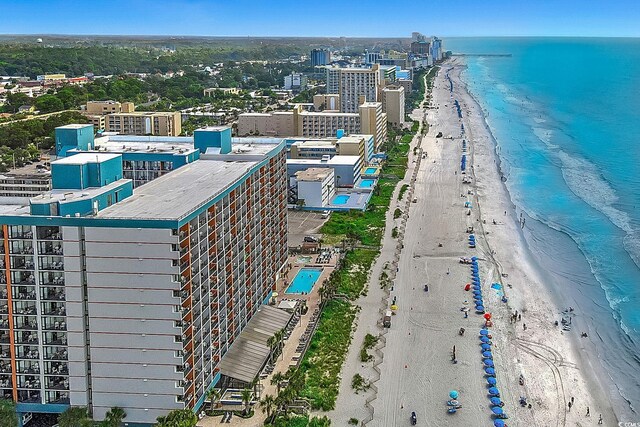 birds eye view of property featuring a view of the beach and a water view