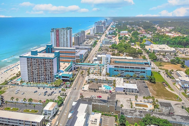 birds eye view of property featuring a water view and a view of the beach