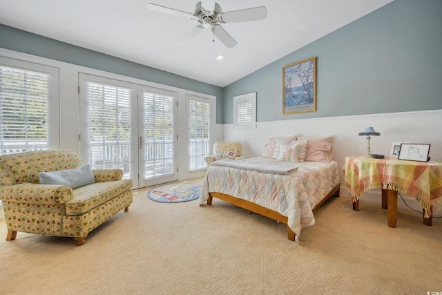 bedroom with access to outside, light carpet, ceiling fan, and vaulted ceiling