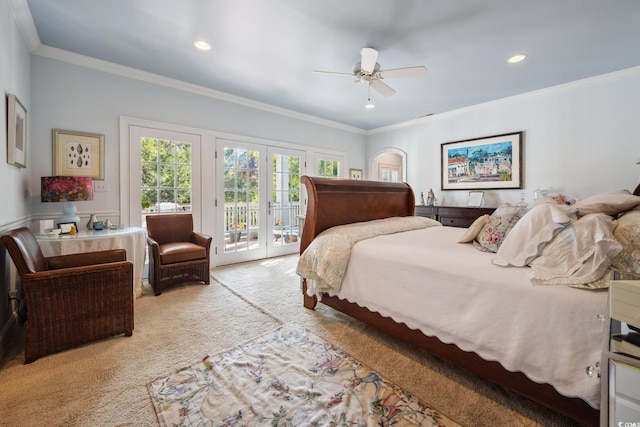 carpeted bedroom with french doors, ceiling fan, crown molding, and access to outside