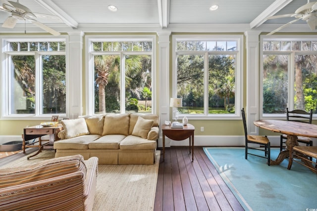 sunroom / solarium with a wealth of natural light, beamed ceiling, and ceiling fan