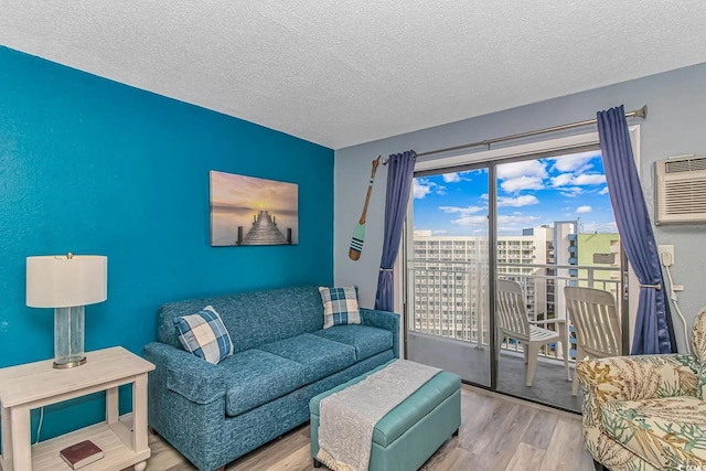 1207 S Ocean Blvd Unit 51408, Myrtle Beach, SC 29577 - living area with wood finished floors, a textured ceiling, a wall mounted air conditioner, and a view of city