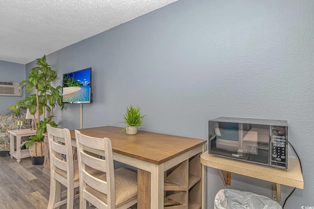1207 S Ocean Blvd Unit 51408, Myrtle Beach, SC 29577 - dining room featuring wood finished floors and a textured ceiling