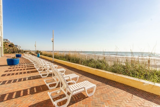1207 S Ocean Blvd Unit 51408, Myrtle Beach, SC 29577 - view of patio featuring view of water and beach