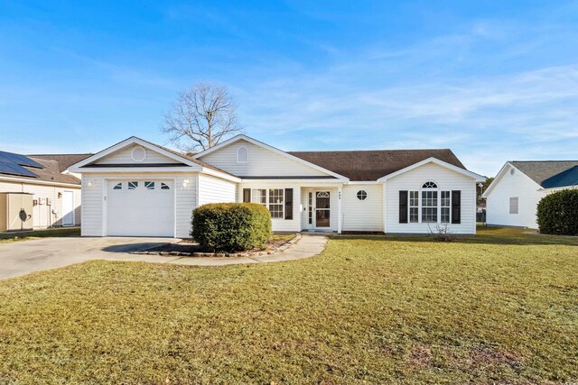 ranch-style house featuring a garage and a front lawn