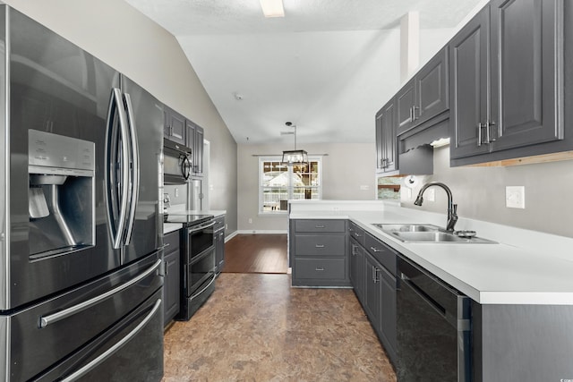 kitchen with stainless steel appliances, a peninsula, a sink, vaulted ceiling, and gray cabinets