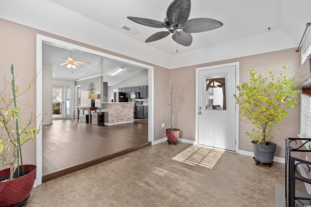 entryway with a ceiling fan, lofted ceiling, visible vents, and baseboards