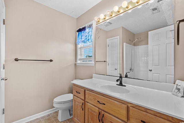 bathroom featuring baseboards, a shower, toilet, tile patterned flooring, and vanity