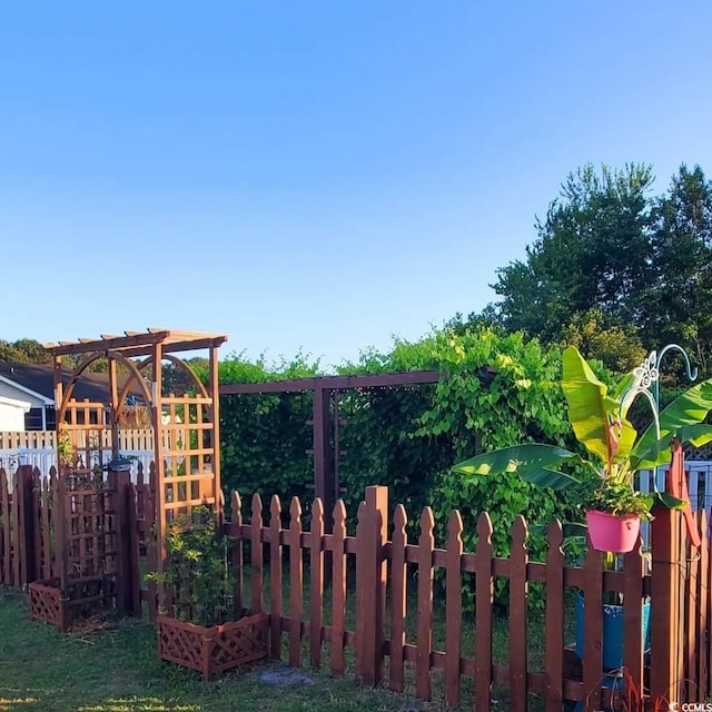 view of gate featuring fence