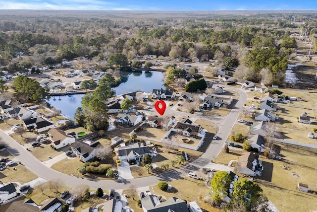 drone / aerial view featuring a water view and a residential view