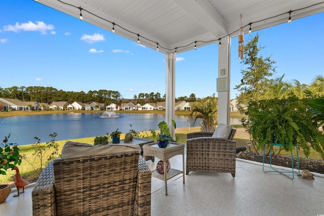 view of patio featuring a water view