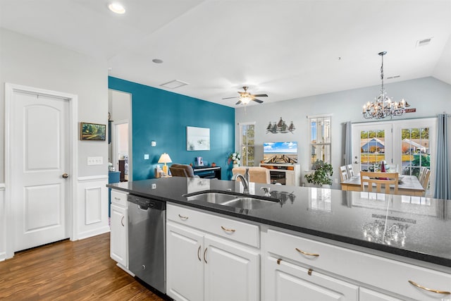 kitchen with dark stone counters, dark hardwood / wood-style floors, sink, white cabinets, and dishwasher