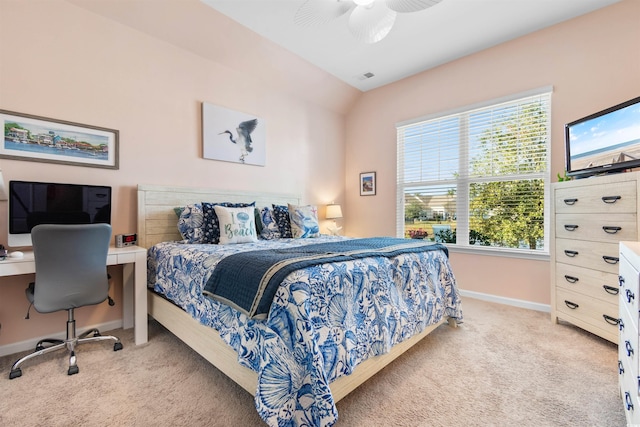 carpeted bedroom featuring vaulted ceiling and ceiling fan