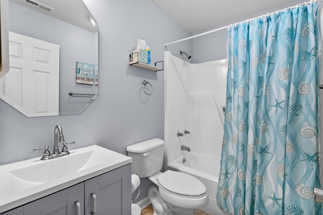 full bathroom featuring vanity, toilet, and shower / tub combo