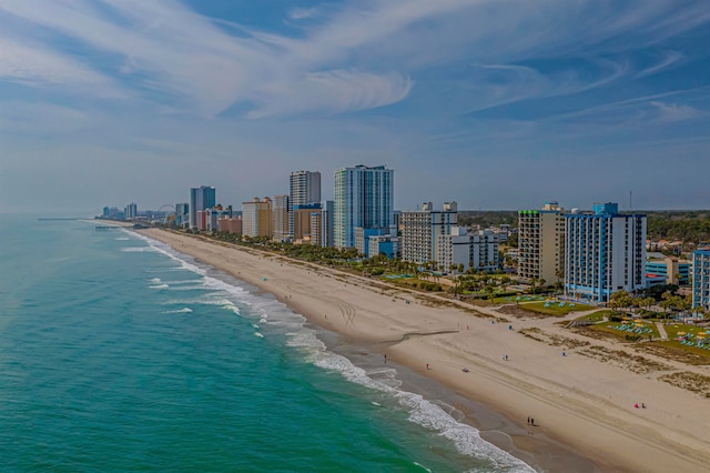 drone / aerial view with a beach view and a water view