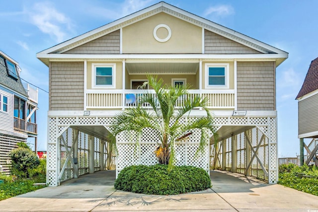 view of front facade featuring a porch and a carport