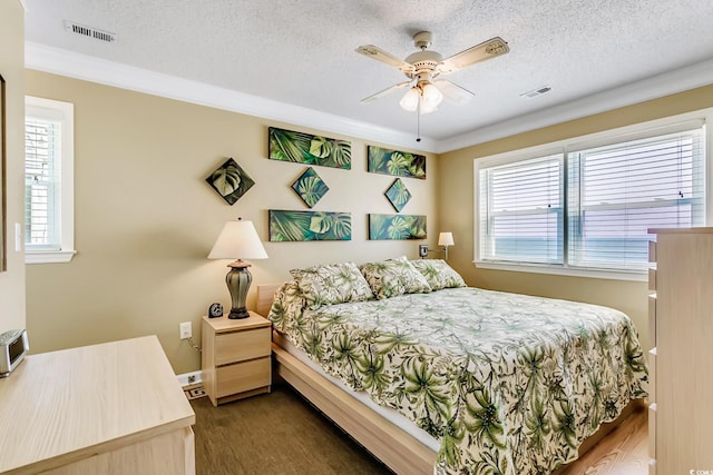 bedroom featuring ceiling fan, a textured ceiling, and dark hardwood / wood-style flooring