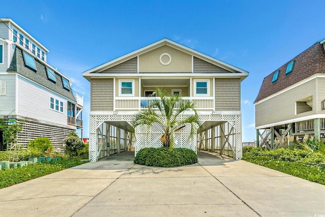 view of front facade with a porch and a carport