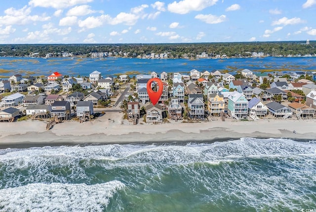 aerial view featuring a view of the beach and a water view