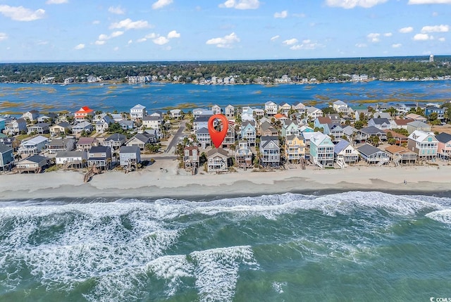 aerial view with a view of the beach and a water view