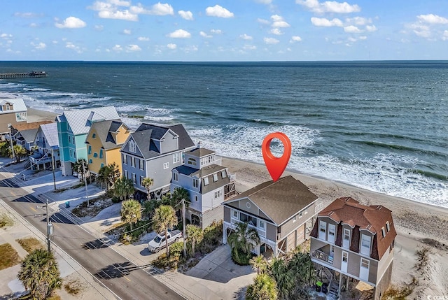 bird's eye view with a beach view and a water view