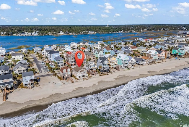 aerial view featuring a view of the beach and a water view