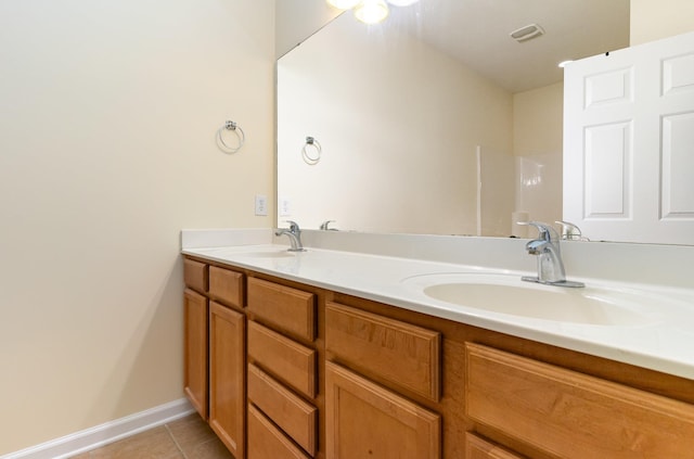 bathroom featuring vanity and tile patterned flooring