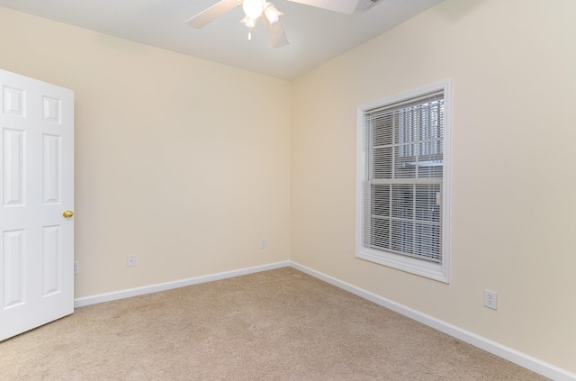 carpeted empty room with ceiling fan