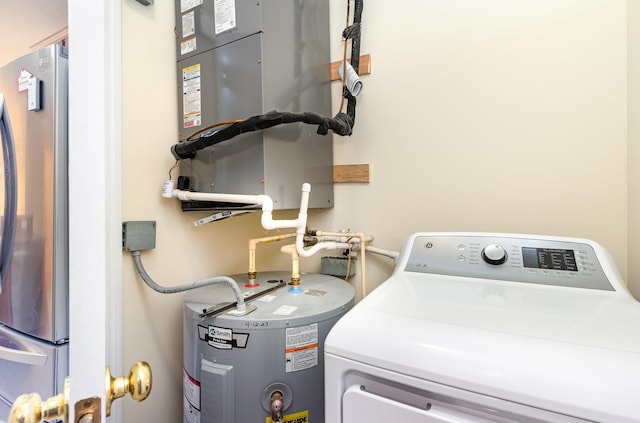 laundry area featuring washer / dryer and electric water heater