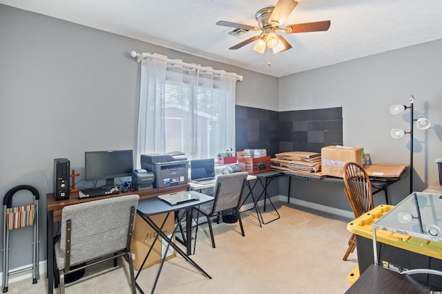 carpeted office with ceiling fan