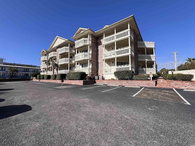 2805 N Ocean Blvd Unit 107, Myrtle Beach, SC 29577 - view of apartment building / complex featuring uncovered parking