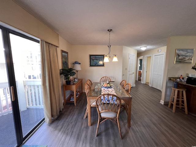 2805 N Ocean Blvd Unit 107, Myrtle Beach, SC 29577 - dining space featuring wood finished floors, plenty of natural light, baseboards, and a chandelier