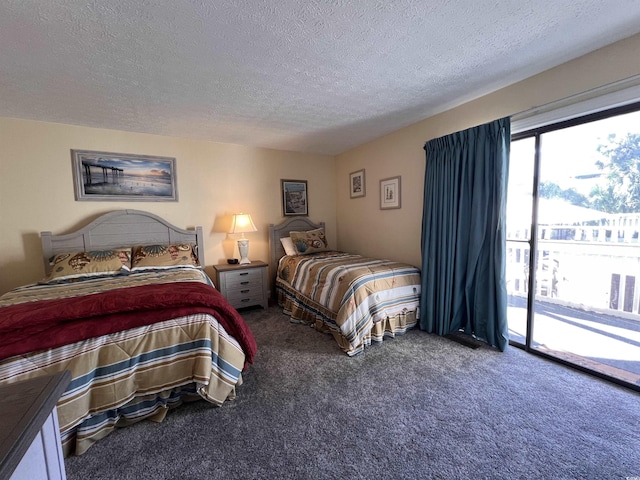 2805 N Ocean Blvd Unit 107, Myrtle Beach, SC 29577 - carpeted bedroom with access to exterior and a textured ceiling