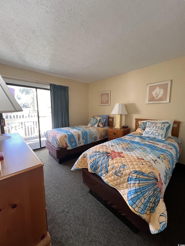 2805 N Ocean Blvd Unit 107, Myrtle Beach, SC 29577 - carpeted bedroom featuring a textured ceiling and access to exterior