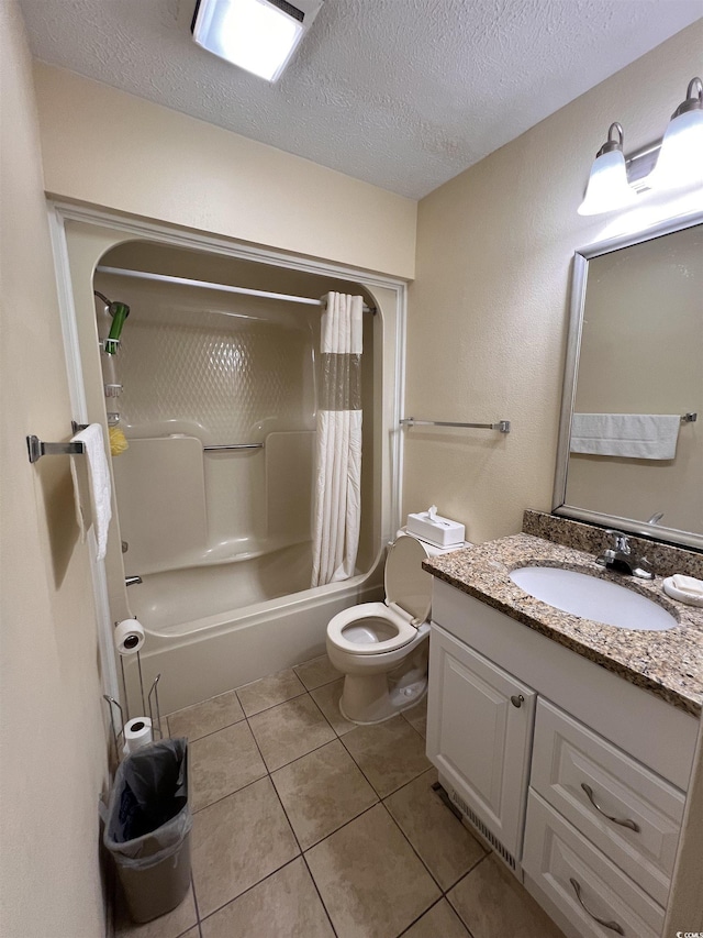 2805 N Ocean Blvd Unit 107, Myrtle Beach, SC 29577 - bathroom featuring tile patterned floors, a textured ceiling, toilet, shower / bath combo with shower curtain, and vanity