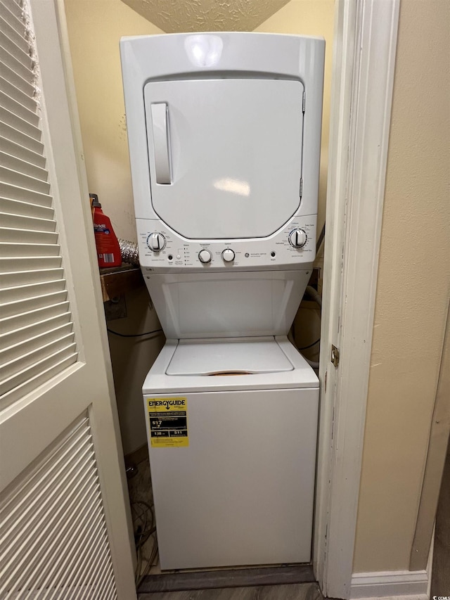 2805 N Ocean Blvd Unit 107, Myrtle Beach, SC 29577 - washroom featuring stacked washer and clothes dryer