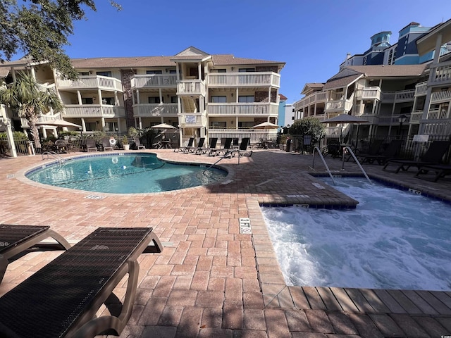 2805 N Ocean Blvd Unit 107, Myrtle Beach, SC 29577 - community pool featuring a patio area and fence