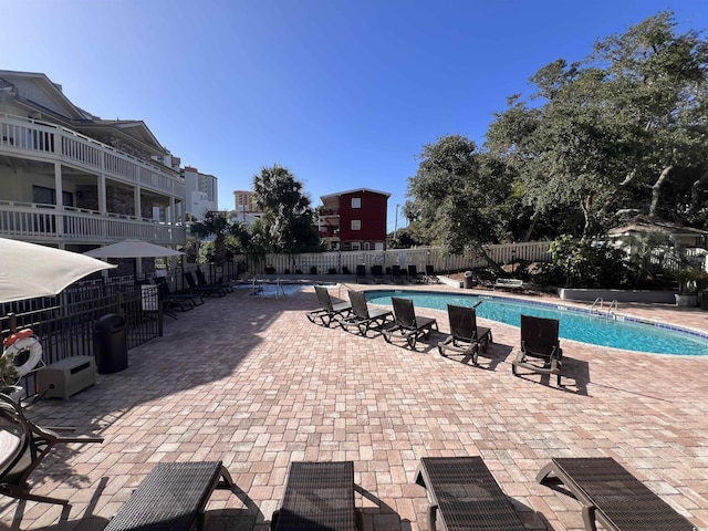 2805 N Ocean Blvd Unit 107, Myrtle Beach, SC 29577 - community pool featuring fence and a patio