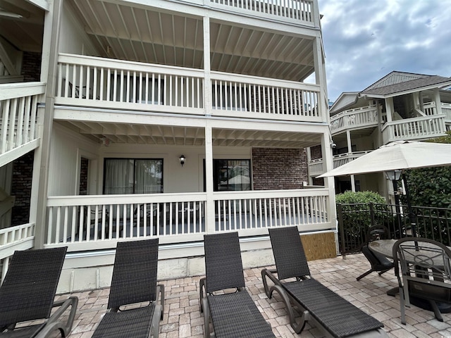 2805 N Ocean Blvd Unit 107, Myrtle Beach, SC 29577 - view of patio / terrace featuring a balcony, covered porch, and fence