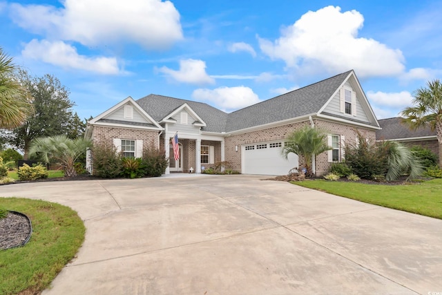 116 Ocean Sands Ct, Myrtle Beach, SC 29579 - view of front facade with a garage, roof with shingles, brick siding, and driveway