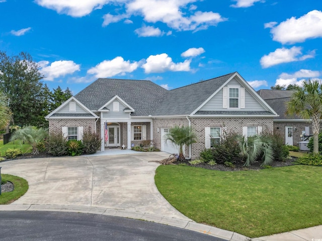 view of front facade with concrete driveway, a garage, brick siding, and a front lawn