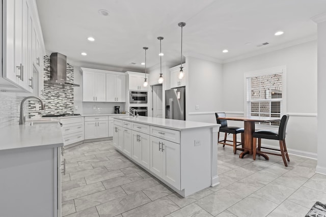 116 Ocean Sands Ct, Myrtle Beach, SC 29579 - kitchen featuring light countertops, crown molding, wall chimney range hood, and stainless steel appliances