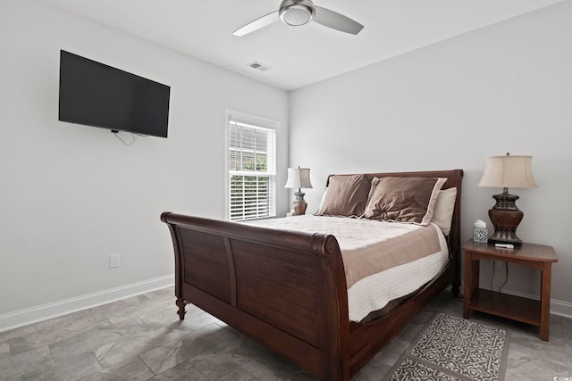 bedroom with a ceiling fan, baseboards, and visible vents