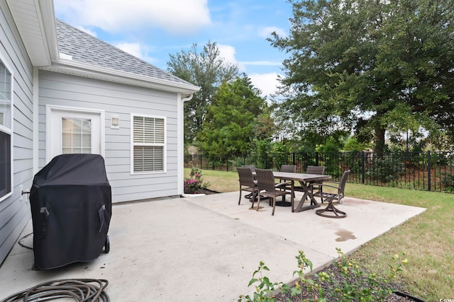 view of patio / terrace with outdoor dining space, a fenced backyard, and a grill