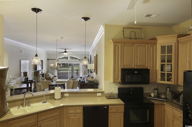 kitchen featuring pendant lighting, black appliances, ceiling fan with notable chandelier, sink, and decorative backsplash