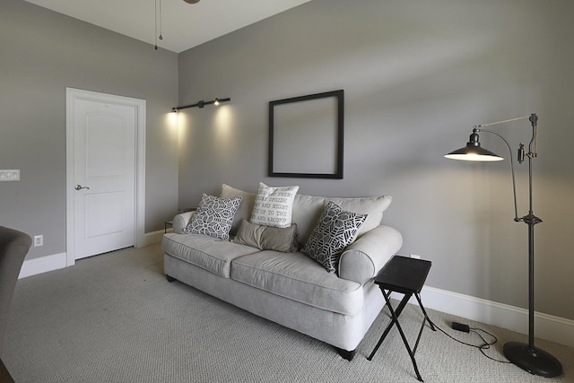 living room featuring ceiling fan and carpet floors