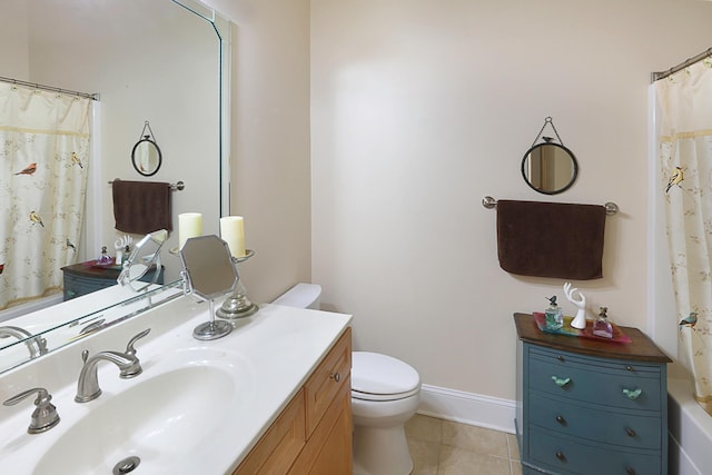 bathroom featuring tile patterned floors, vanity, and toilet